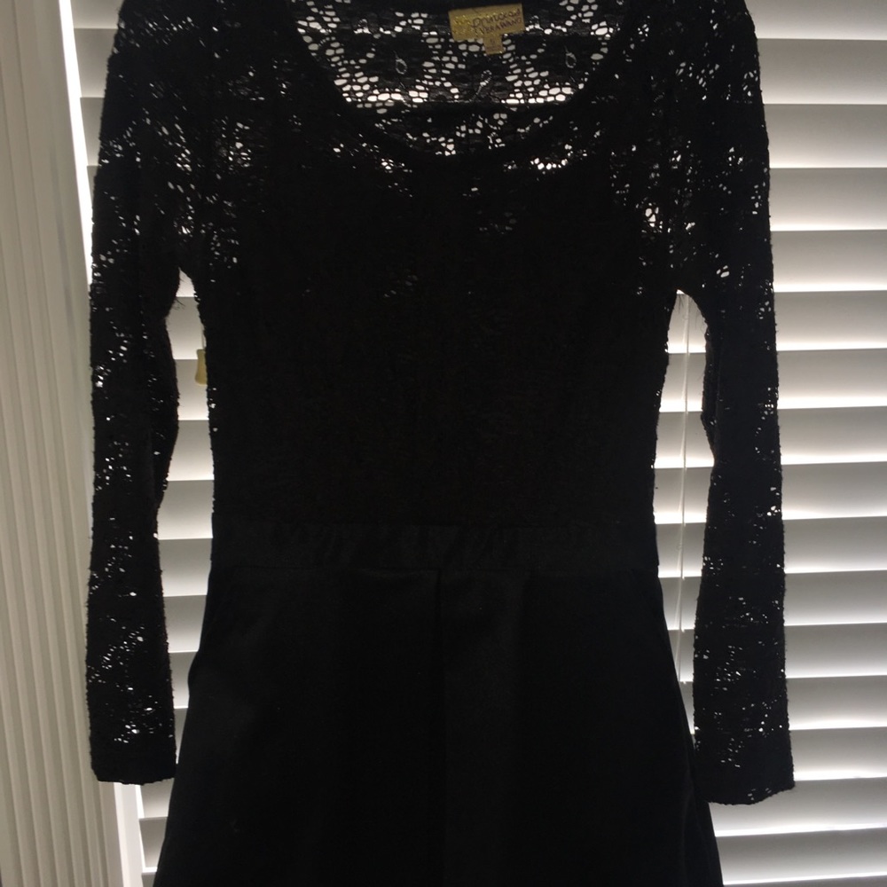 Princess vera wang black lace and leather dress .